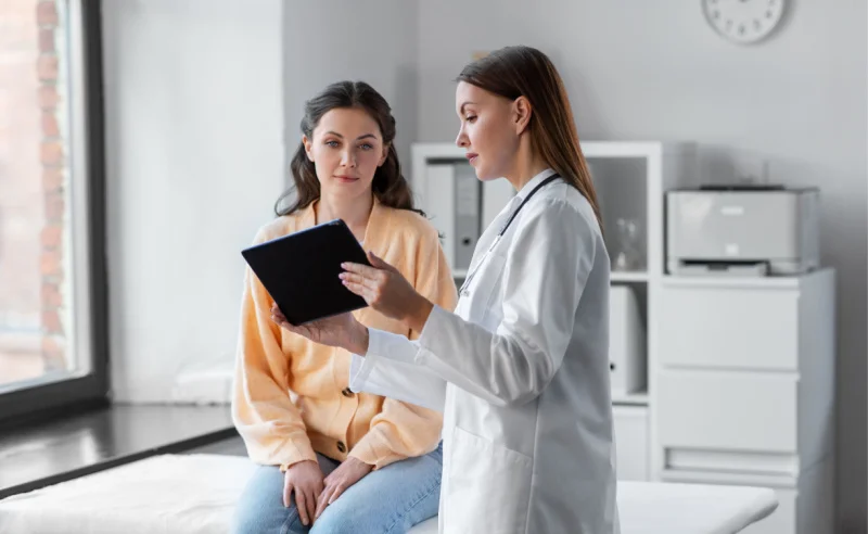 Young woman talks to her doctor about managing Adderall side effects