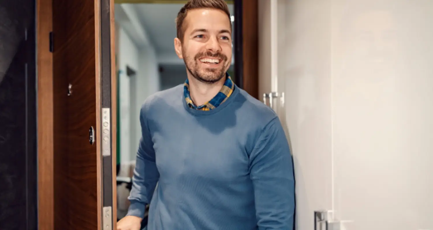 Man smiles as he walks into an outpatient heroin rehab